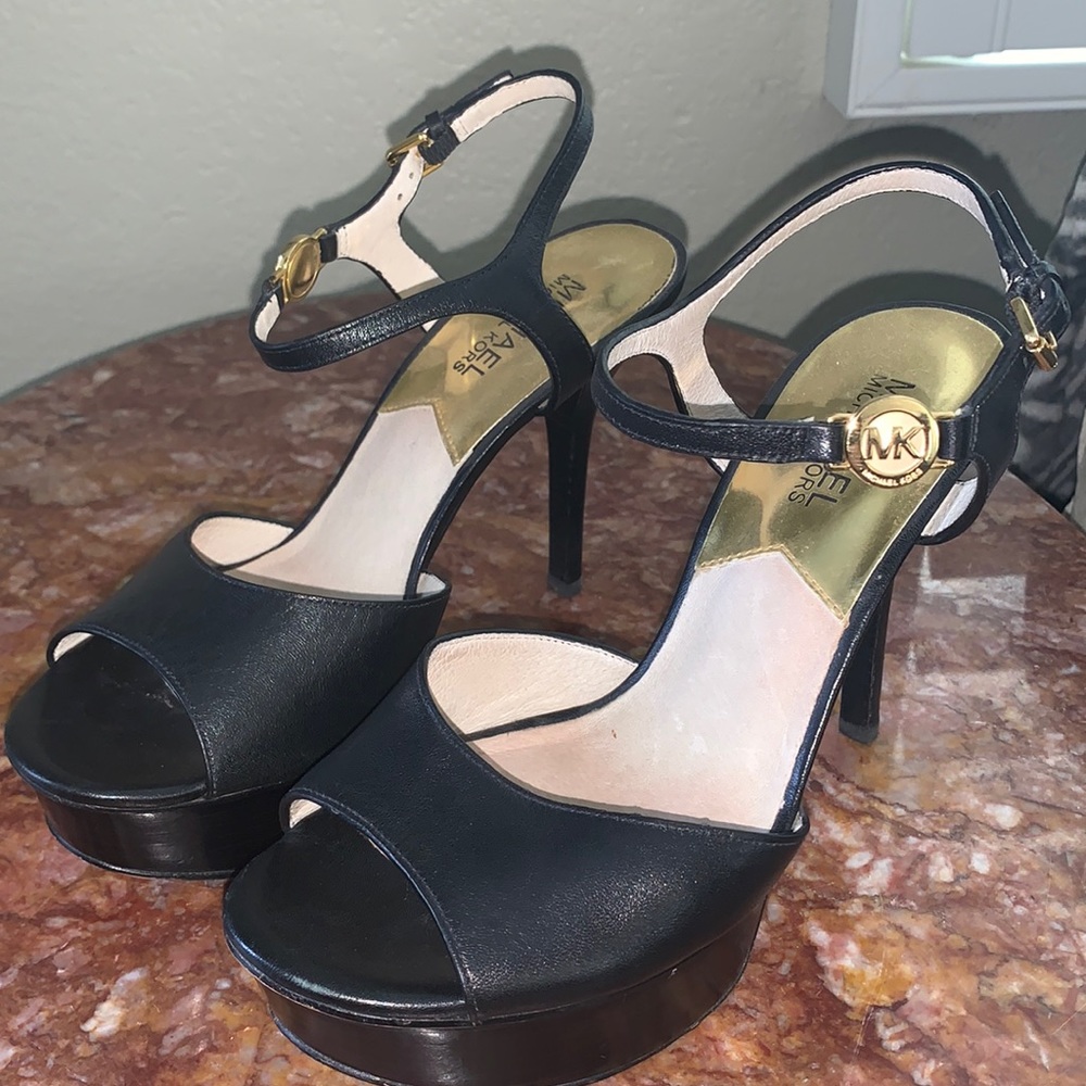 Gorgeous Michael Kors black leather high heeled with 1” platform, like new.